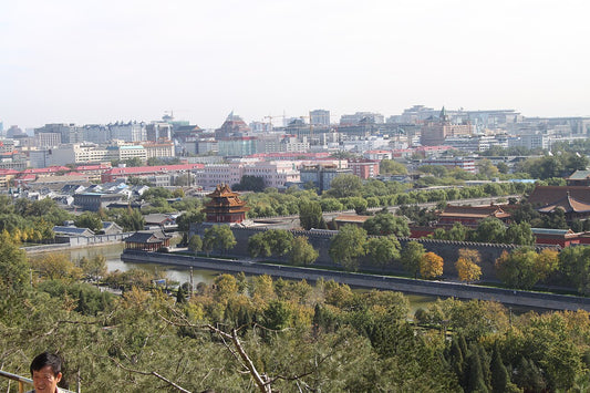 View from Jingshan toward a Forbidden City corner tower, palace wall and surrounding Beijing rooftops