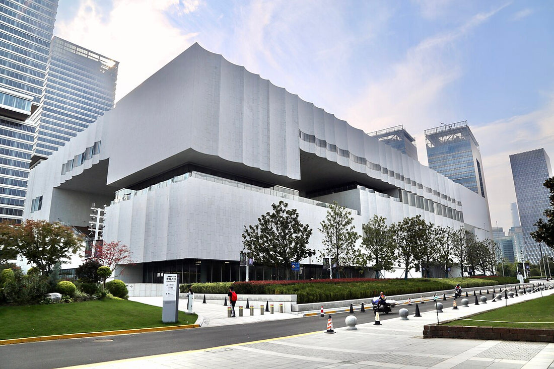 White curved facade of Shanghai Museum East in Pudong