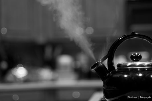 Steam rising from a kettle used to boil drinking water