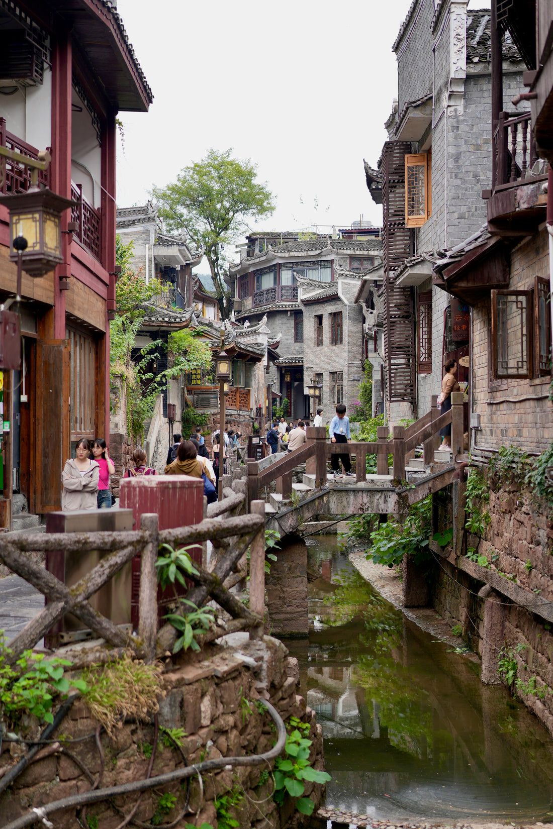 Narrow lane beside a water channel in Fenghuang Ancient Town