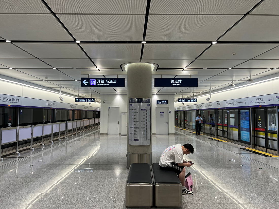 Direction signs and platform doors at Tiantongyuan Dong station on Beijing Subway Line 18