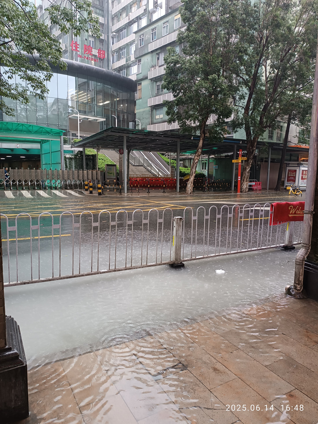 Rainwater covering the pavement beside Yide Road in Guangzhou