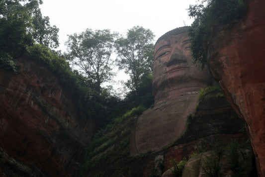 Leshan Giant Buddha seen from the river below the sandstone cliff