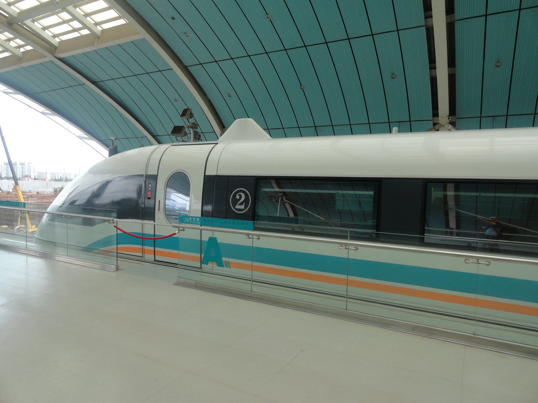 Shanghai Maglev train beside a covered station platform