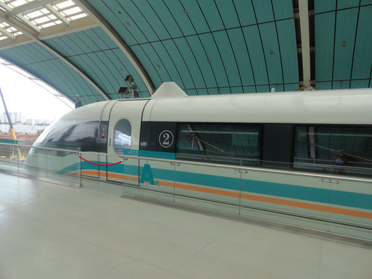 Shanghai Maglev train beside a covered station platform