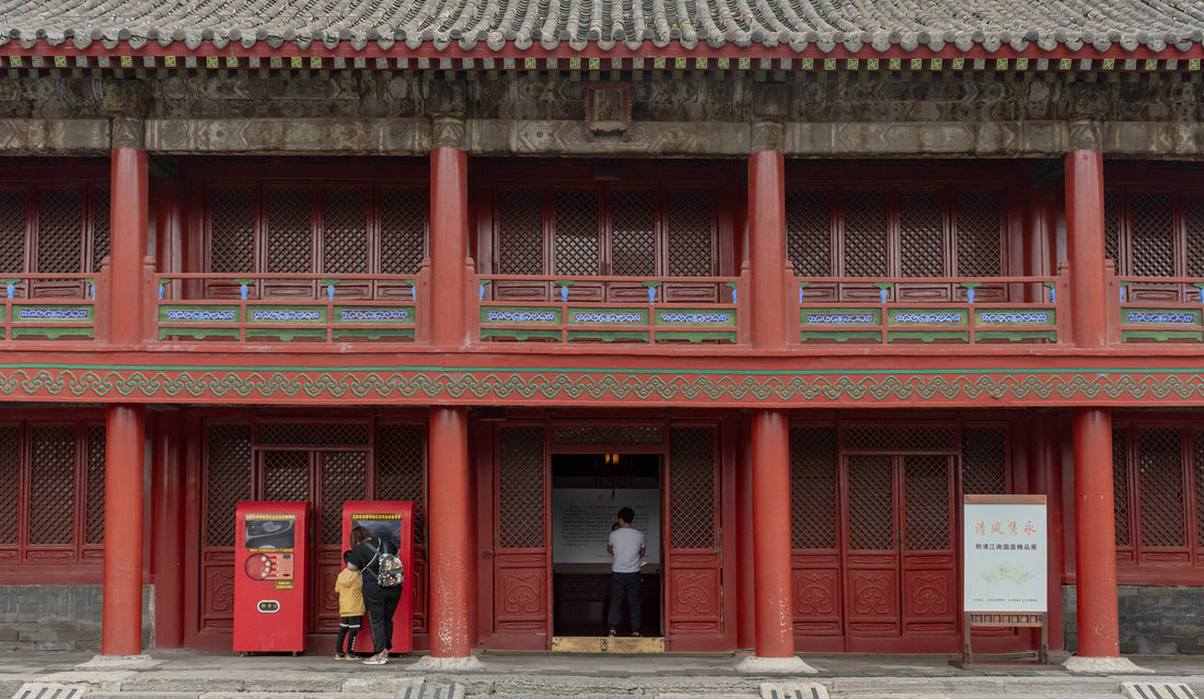 Red columns, lattice doors and painted balcony details at Shenyang Imperial Palace