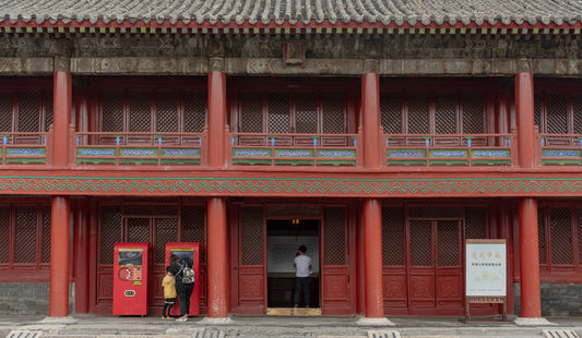 Red columns, lattice doors and painted balcony details at Shenyang Imperial Palace