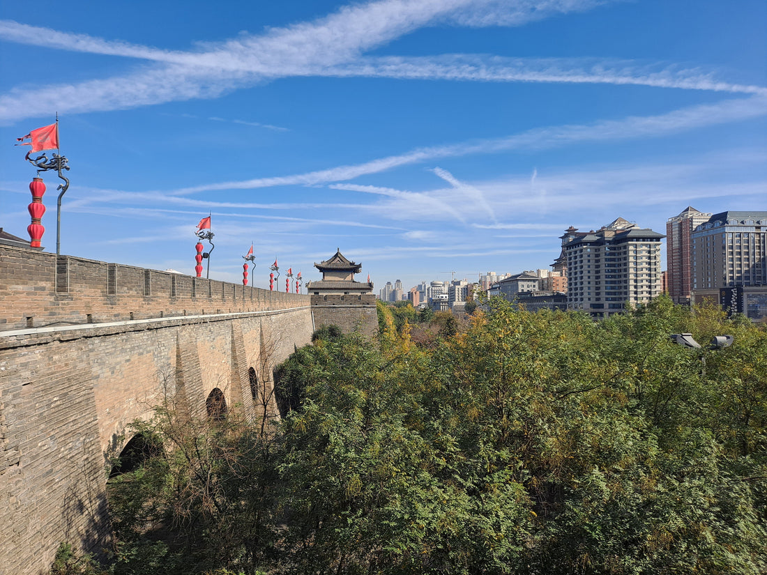 Xi'an City Wall with brick ramparts and a gate tower under a clear sky